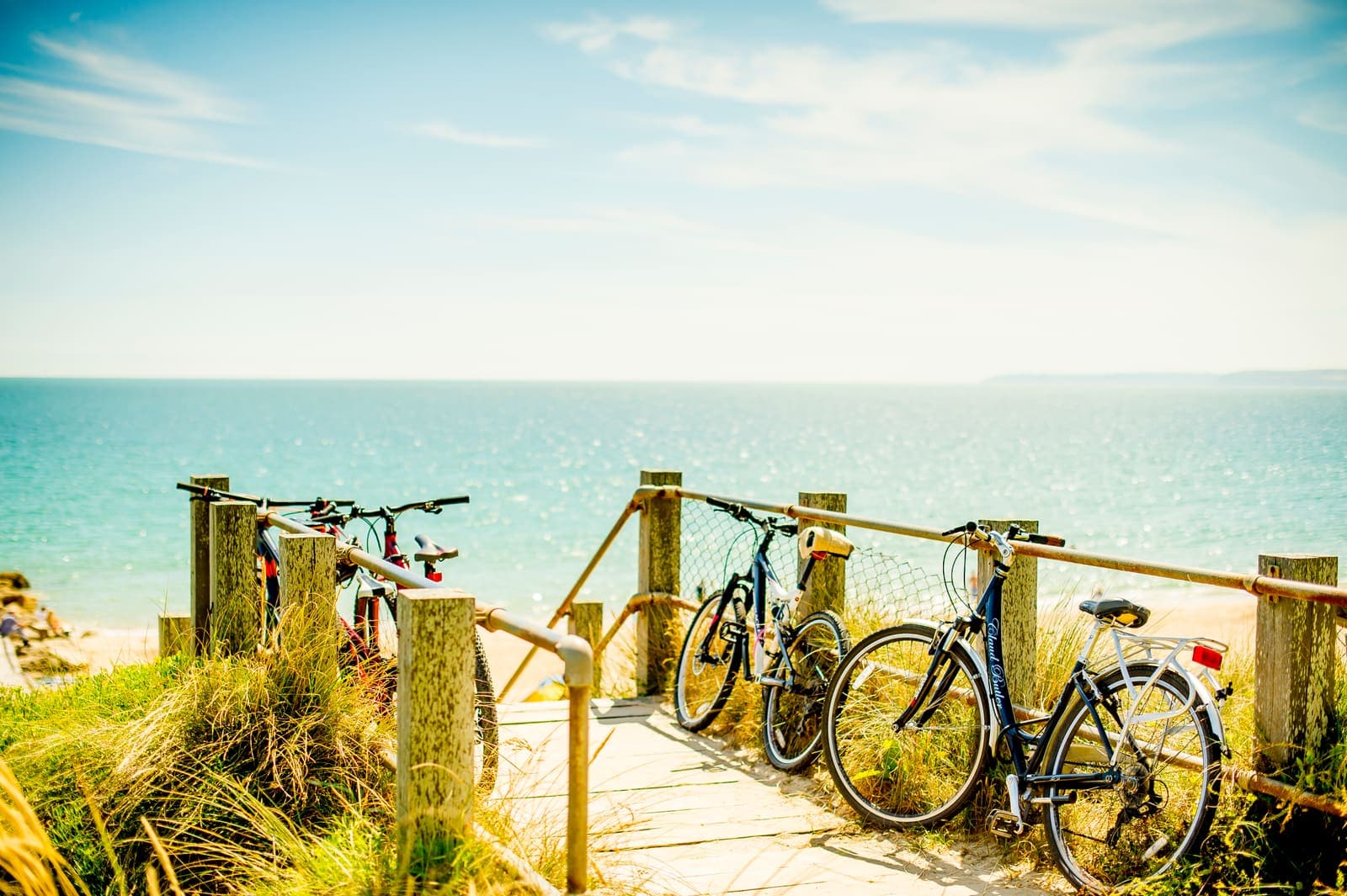 Bikes left at a boardwalk down to the beach