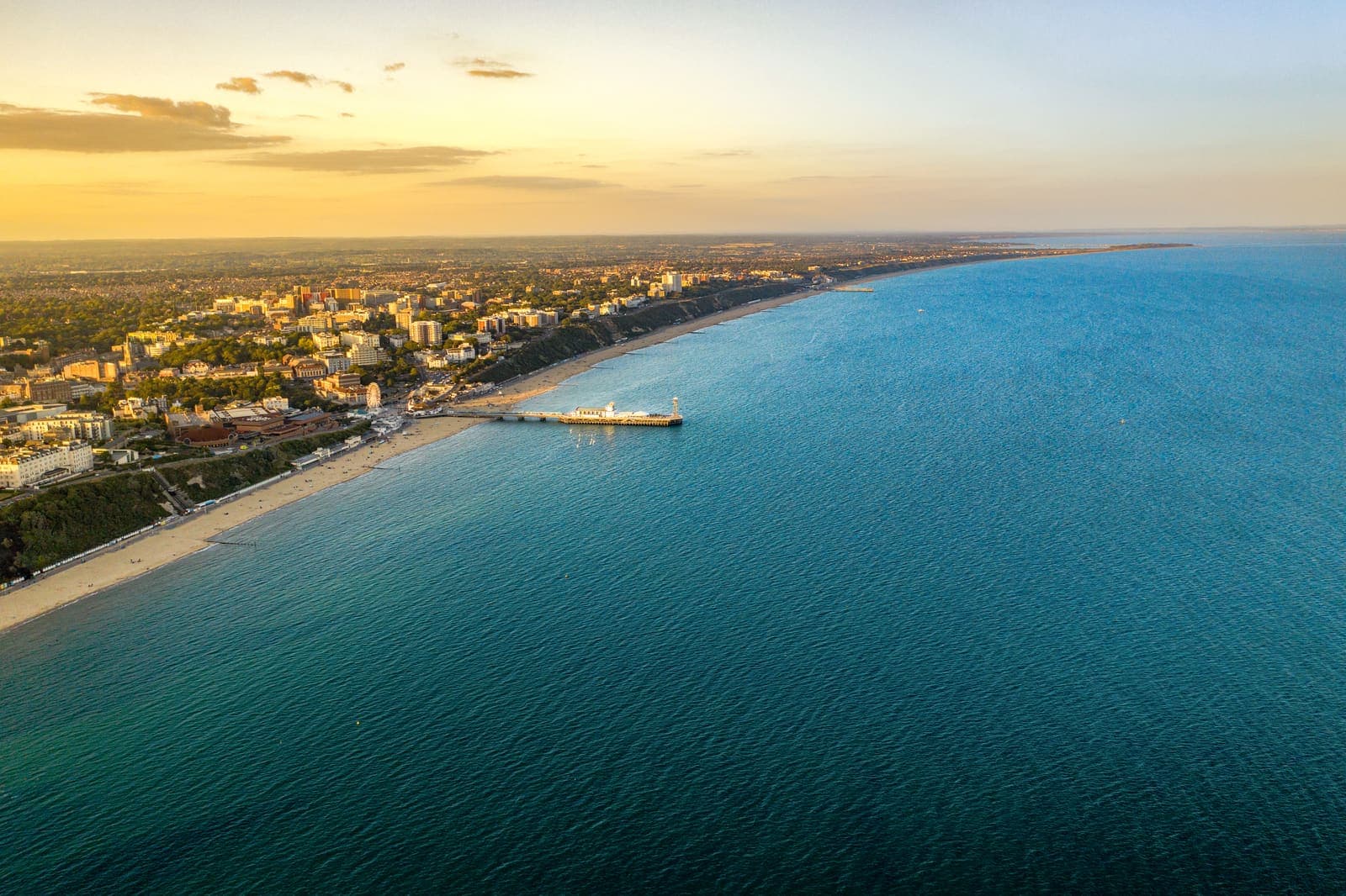 Aerial view of Bournemouth Pier and the seven-mile beach at sunset